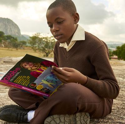 Girl reading the Globe