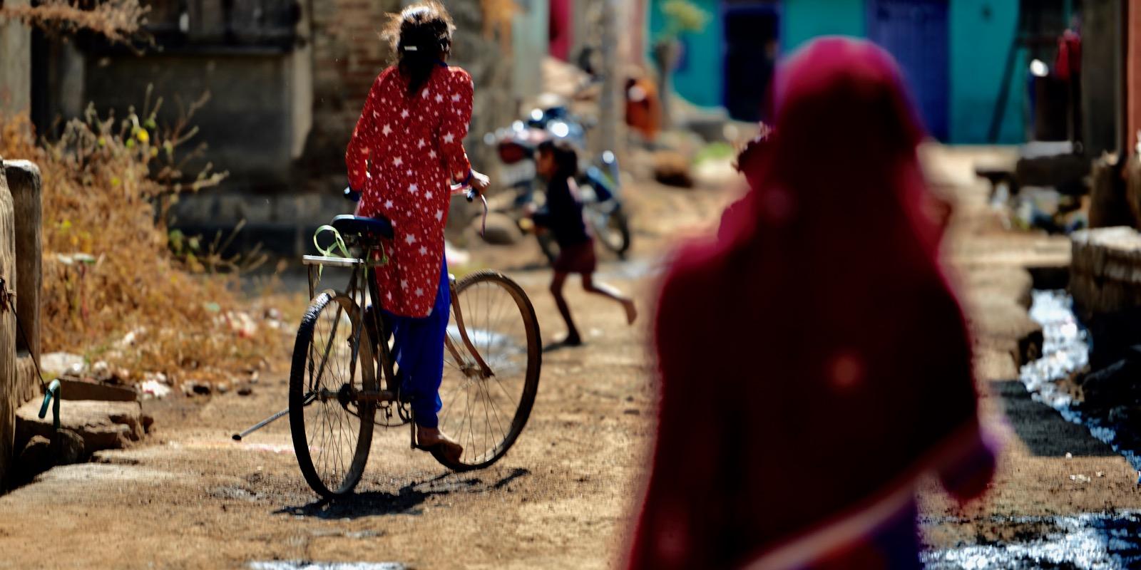 a woman riding a bike