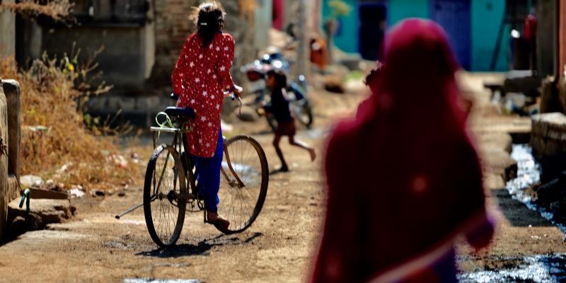 a woman riding a bike