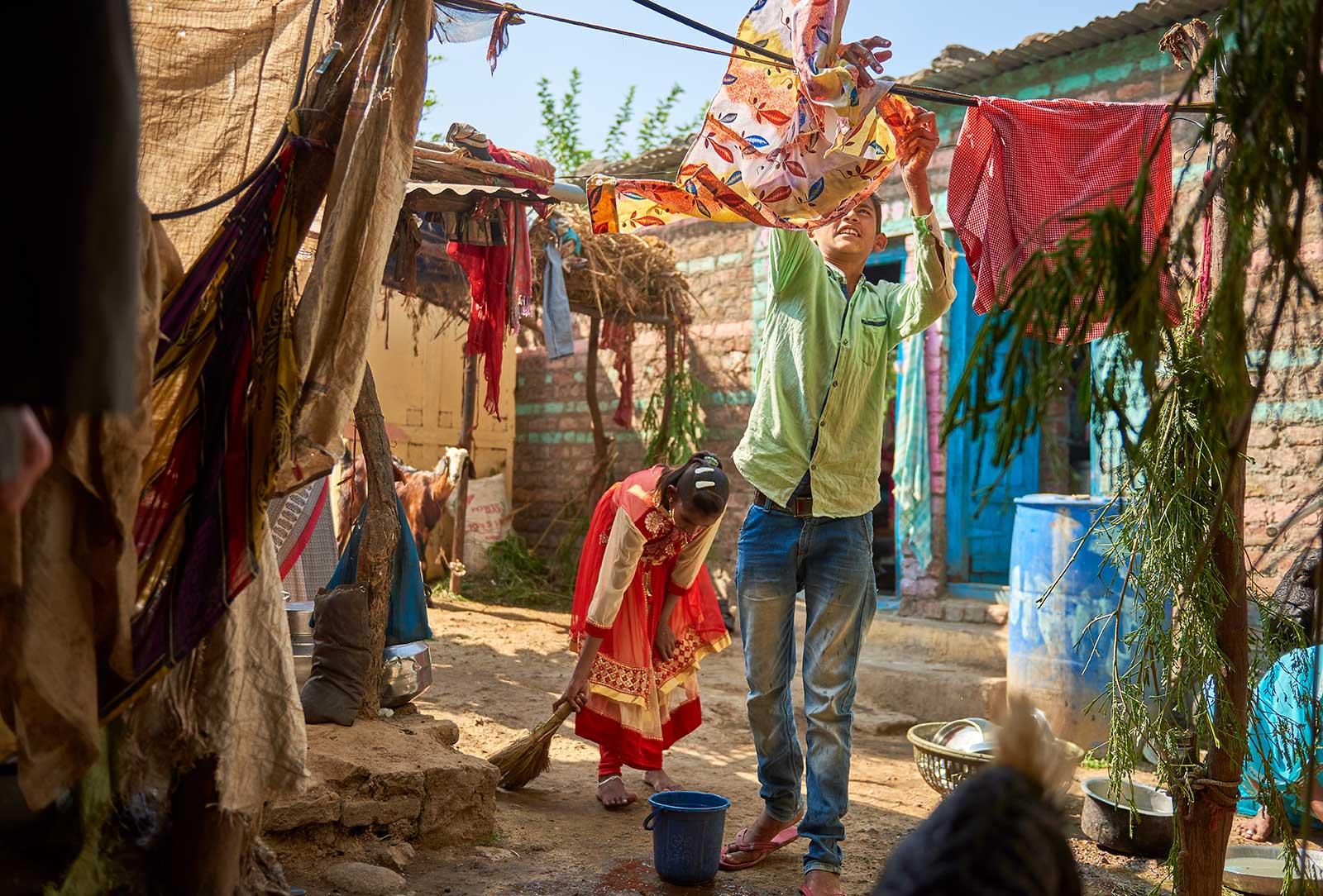 boy hanging laundry