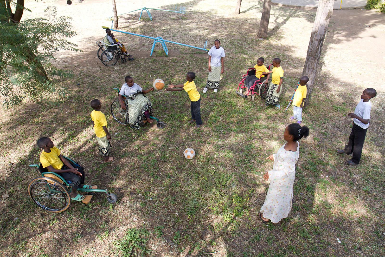 boys in yellow shirts at big playground