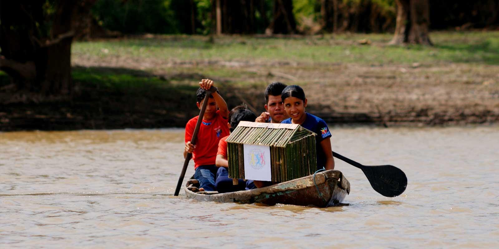 people sailing on a boat with a ballot box