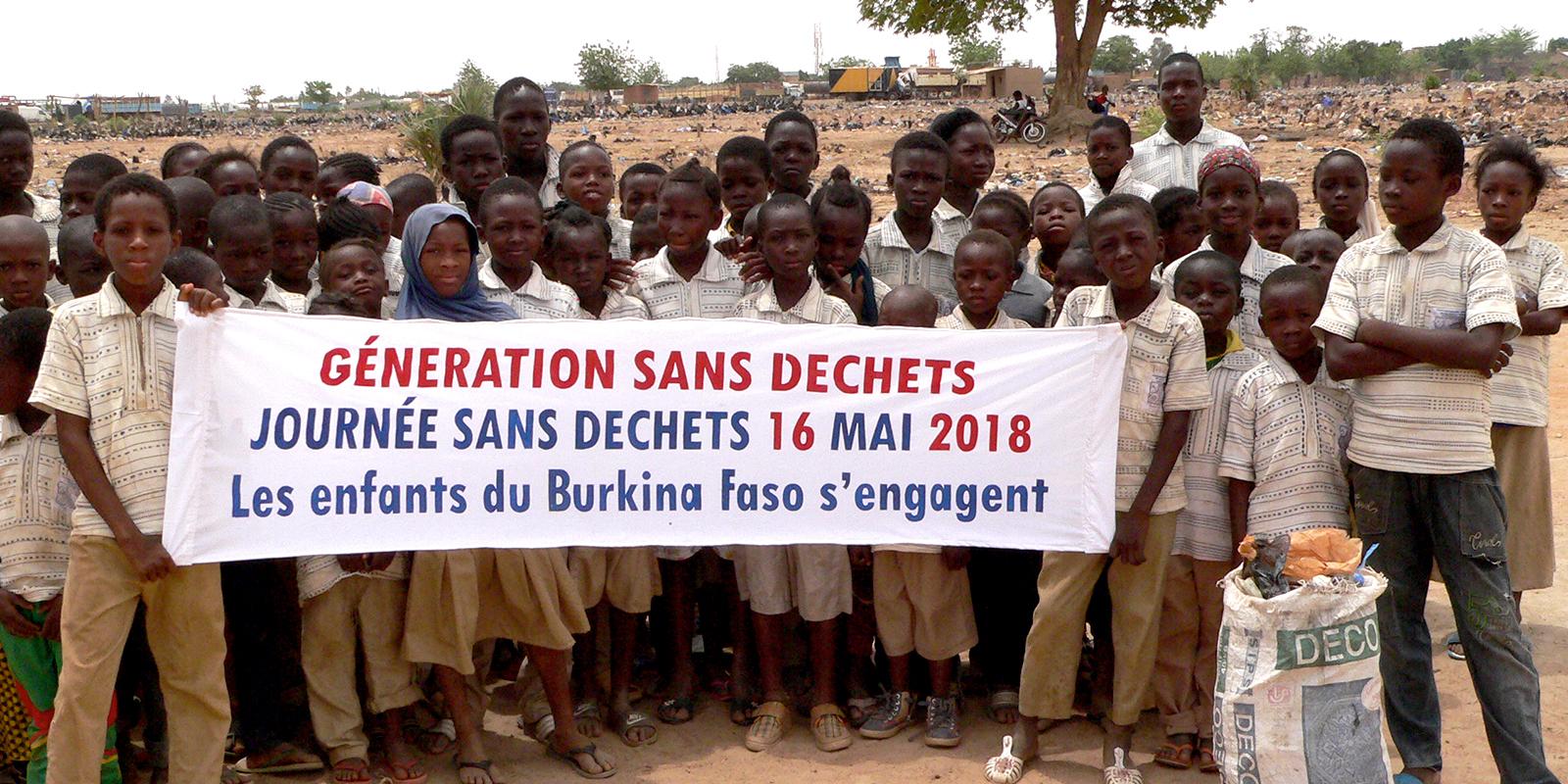 Children holding a banner