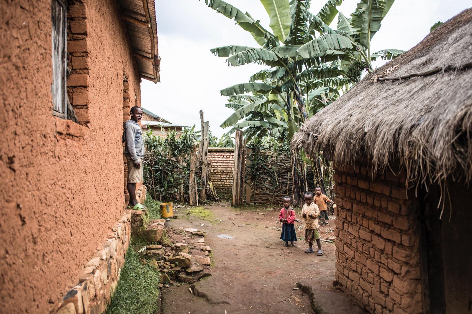 A couple of children between houses.