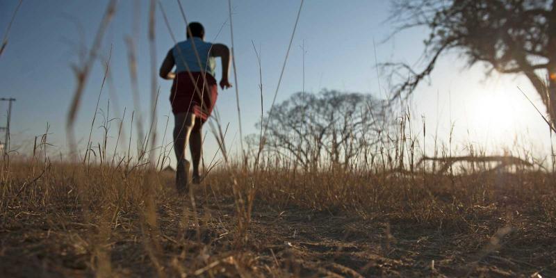 Girl running through the bush