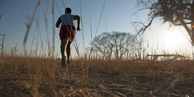Girl running through the bush