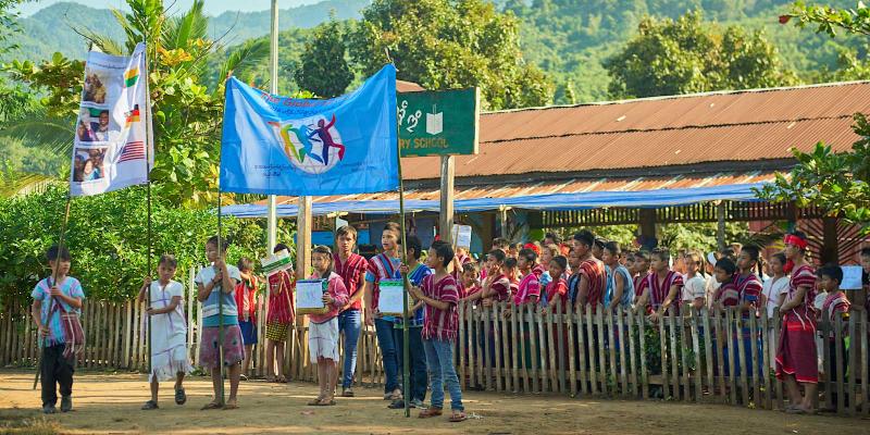 Big group of children with WCP banner