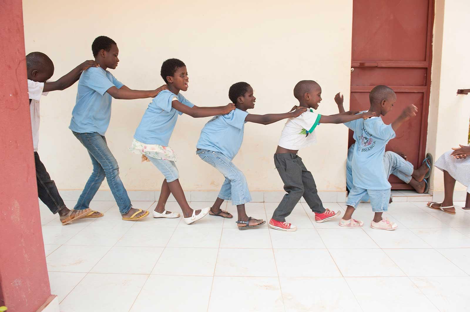 Children helping each other find the way