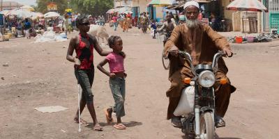 isabel crossing road with friend