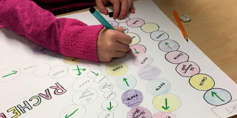 Hands drawing a chart on paper