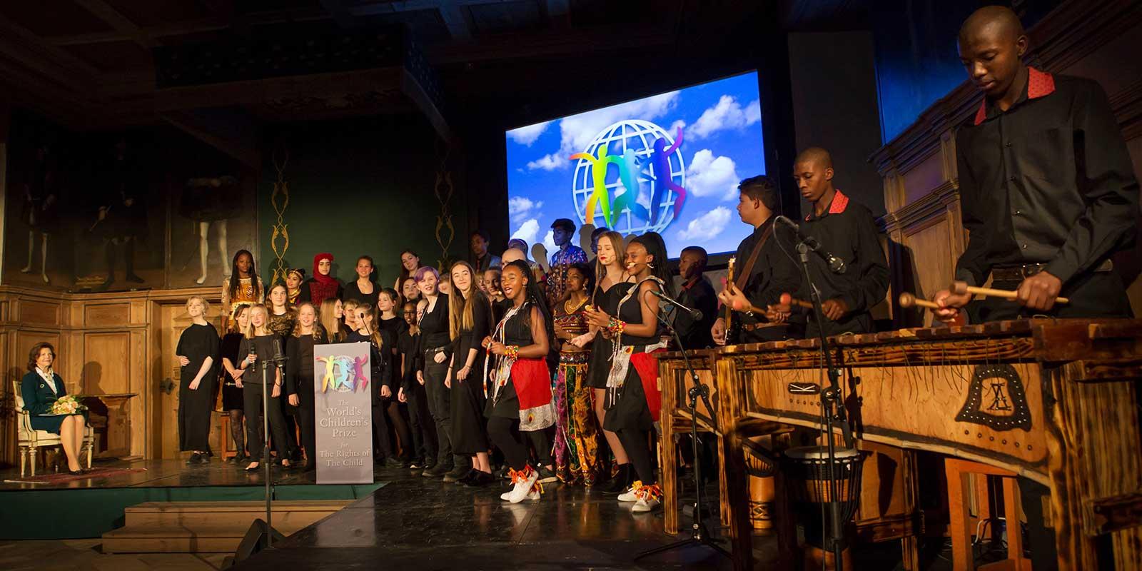 Children on stage singing
