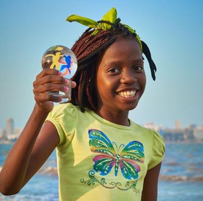 Girl holding up WCP glass globe