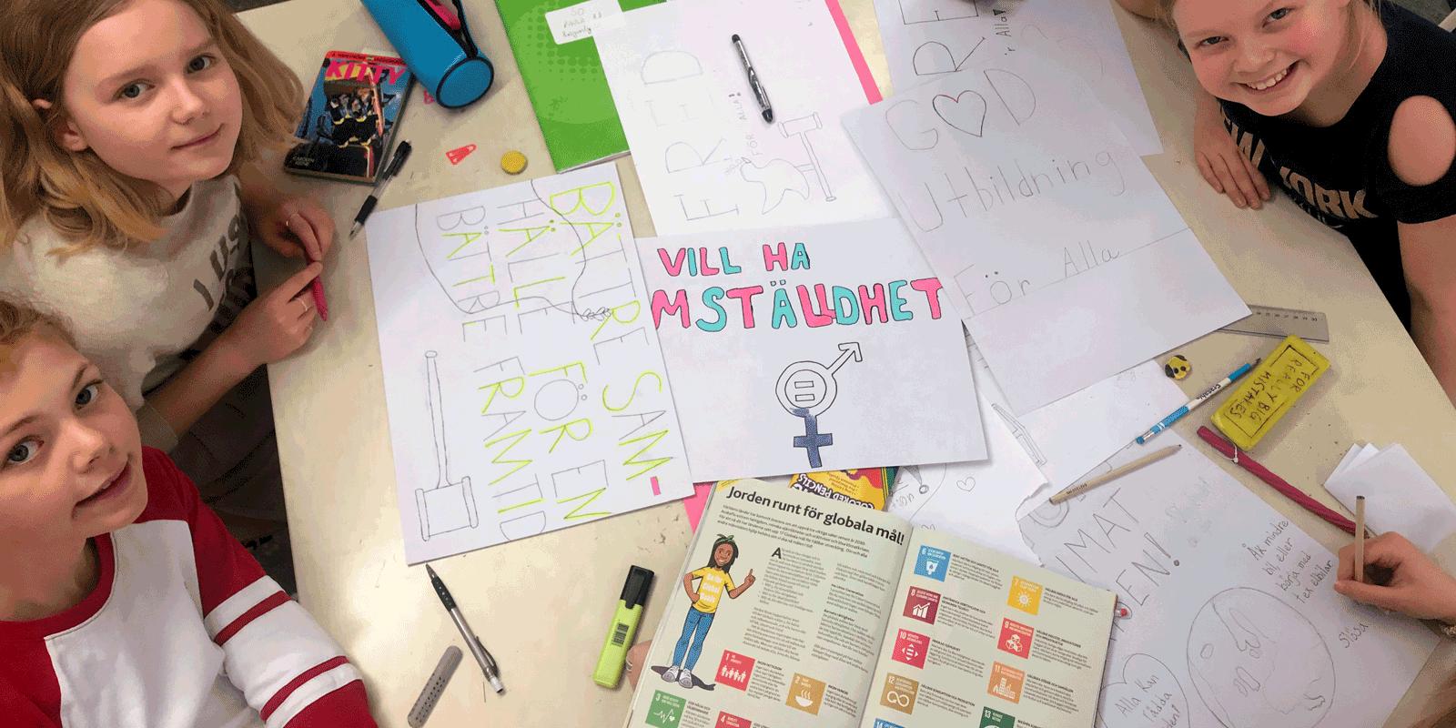 Girls working around table