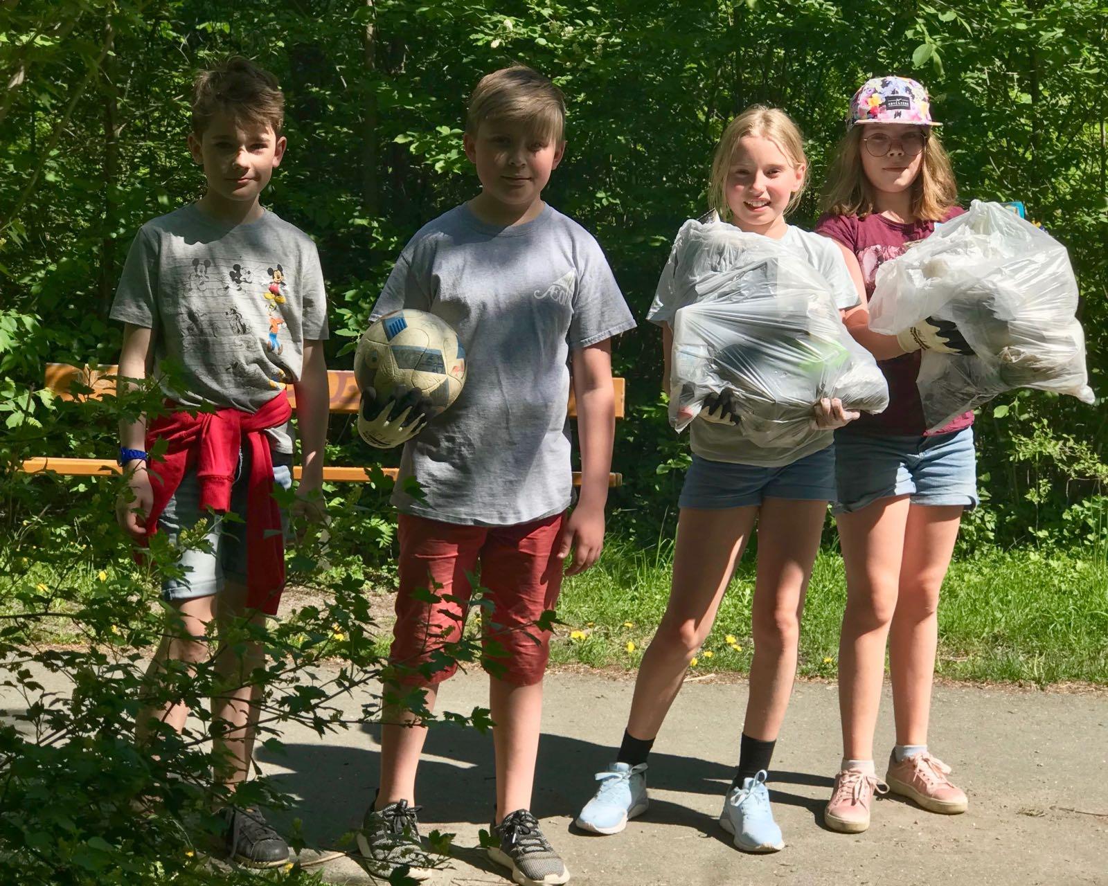 Girls collecting trash