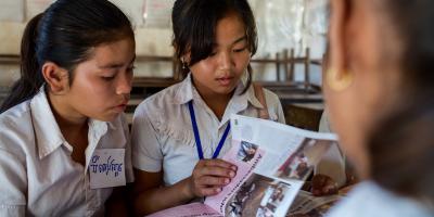 two girls reading the Globe