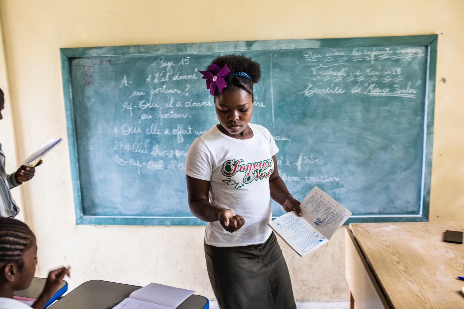 A girl in a classroom.