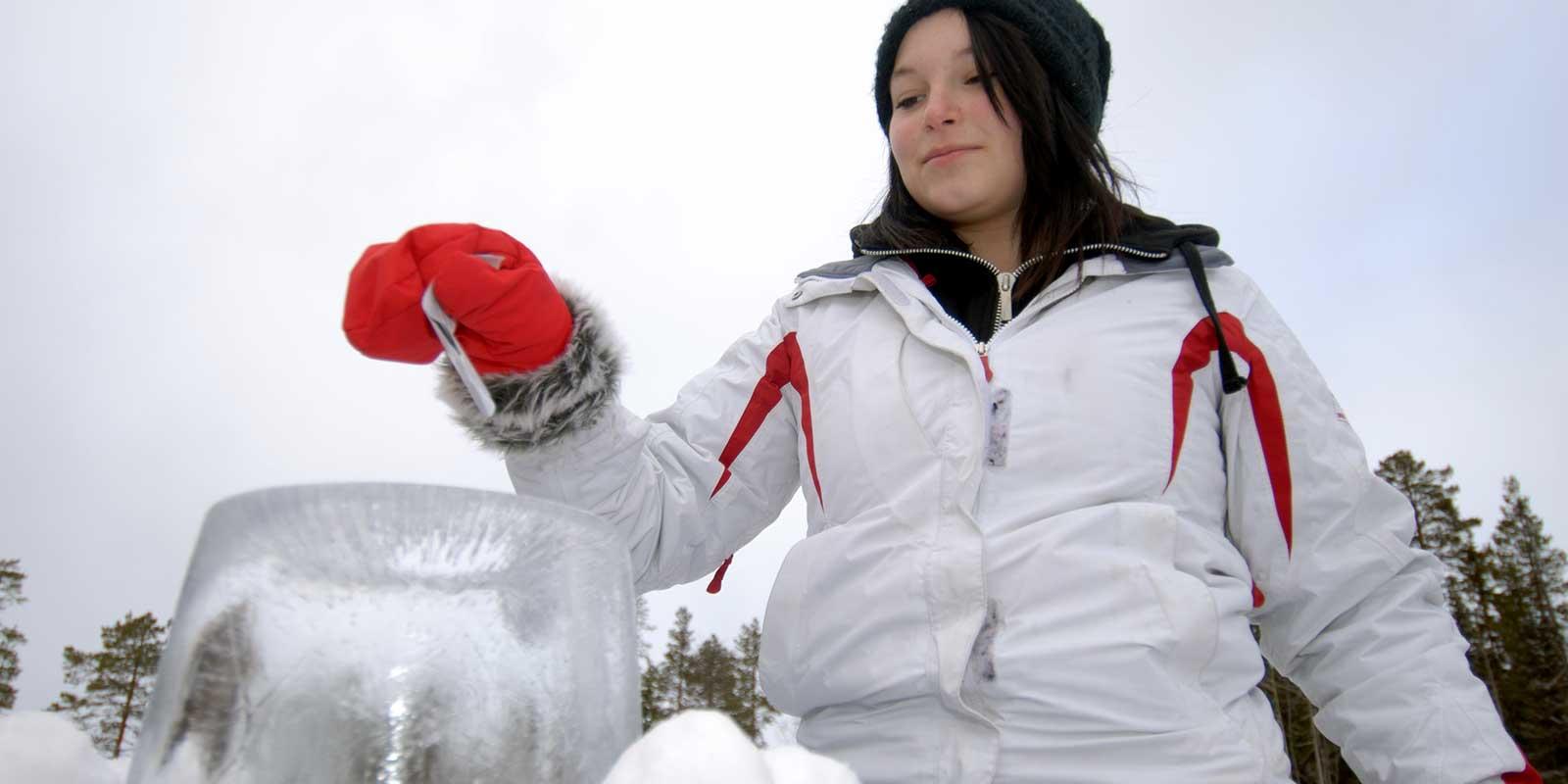 Girl putting ballot in ice ballot box
