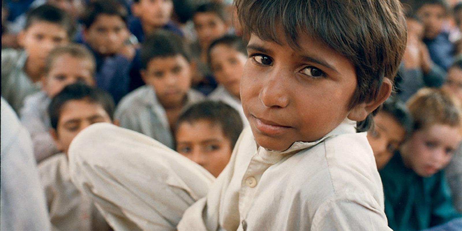 Former bonded slave boy Iqbal Masih in front of crowd.