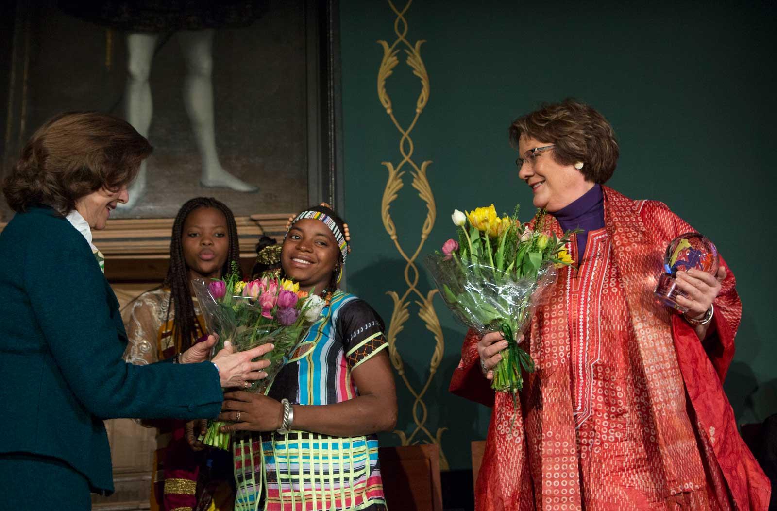 molly melching receiving award