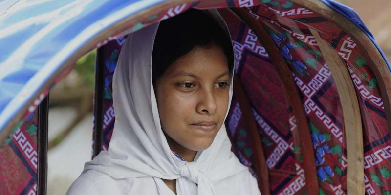 Nuzhat sits in a rikshaw