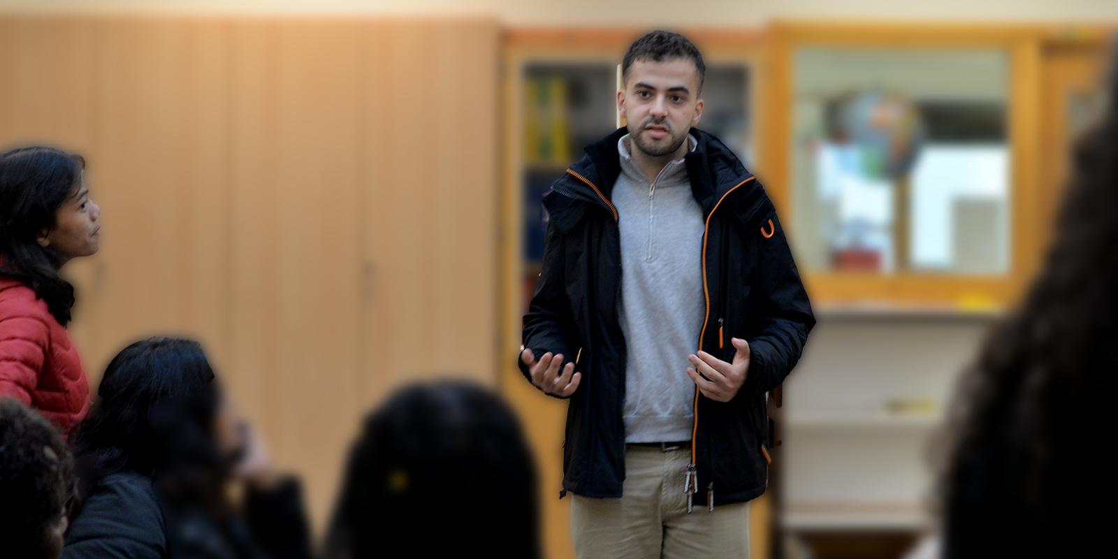 WCP Child Juror Omar talks in front of students.