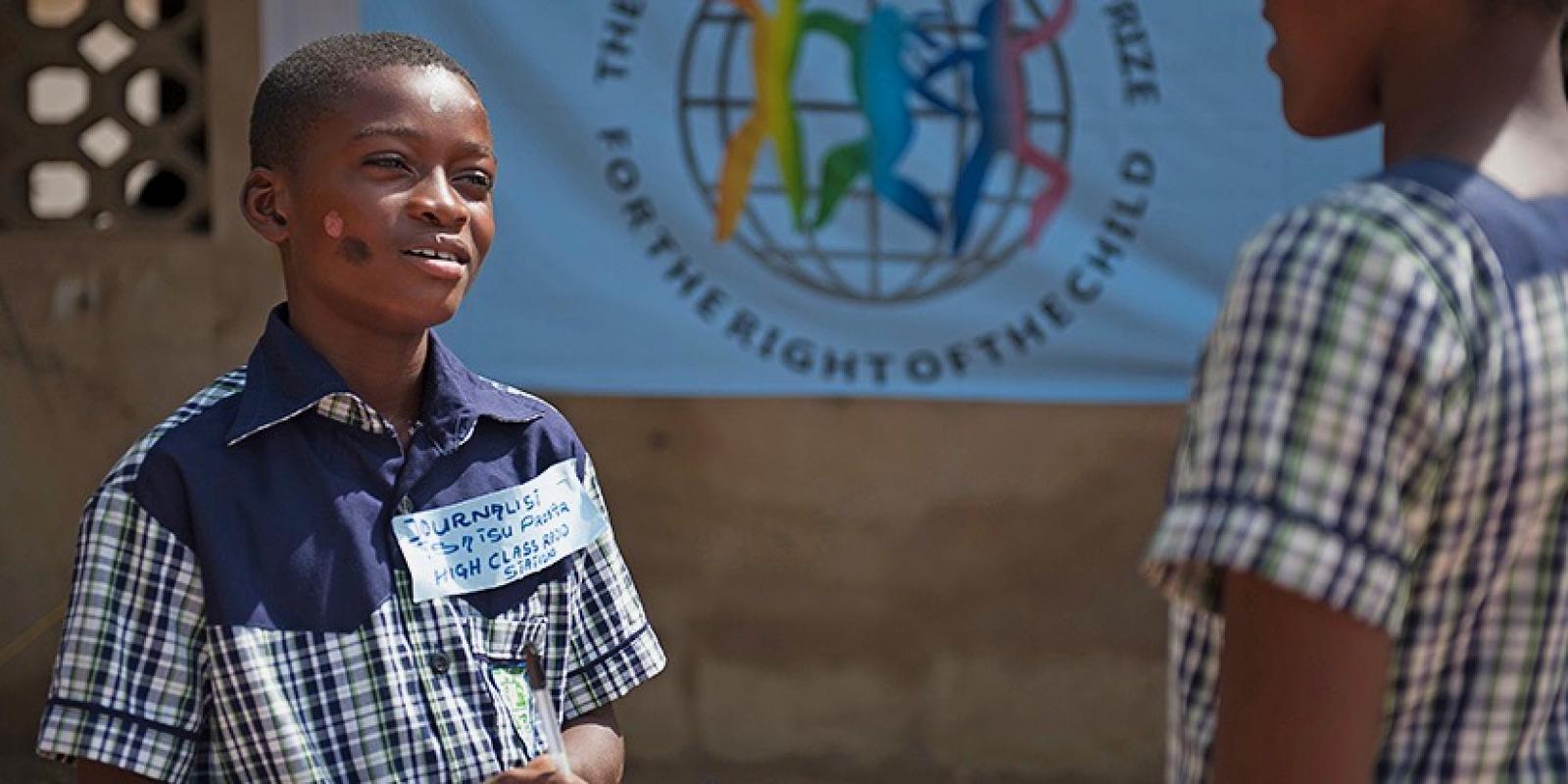 Prosper talks to friend in school