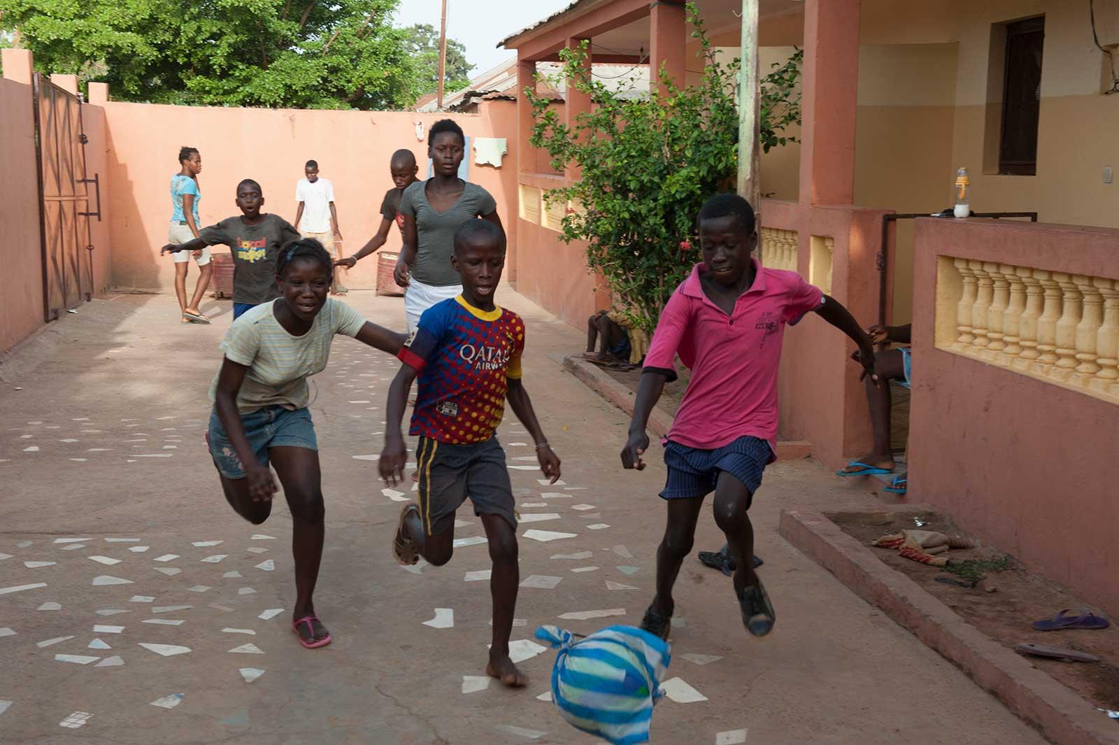 Samuel plays football with friends