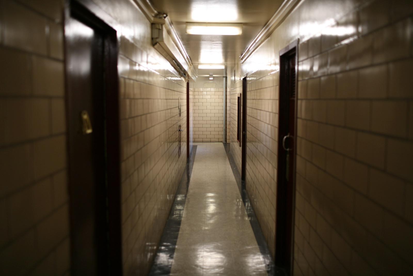 Hallway with cold lights in NYC housing projects.