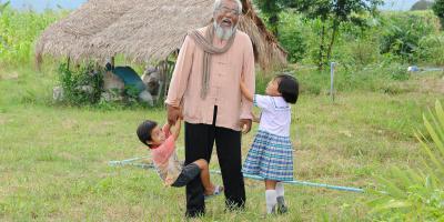 Sompop playing with kids