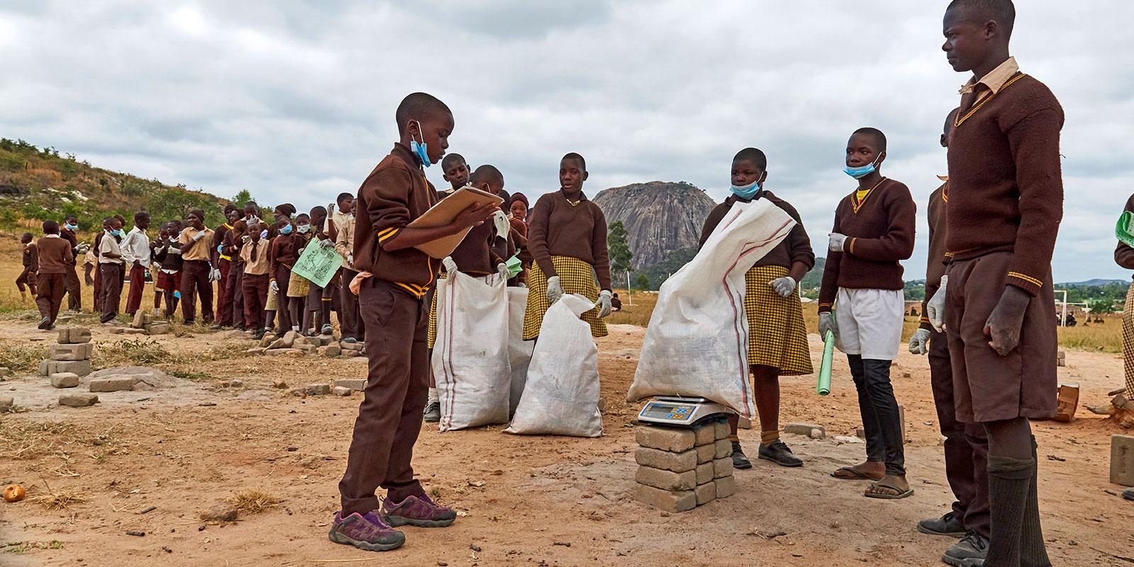Children collecting and weighing litter