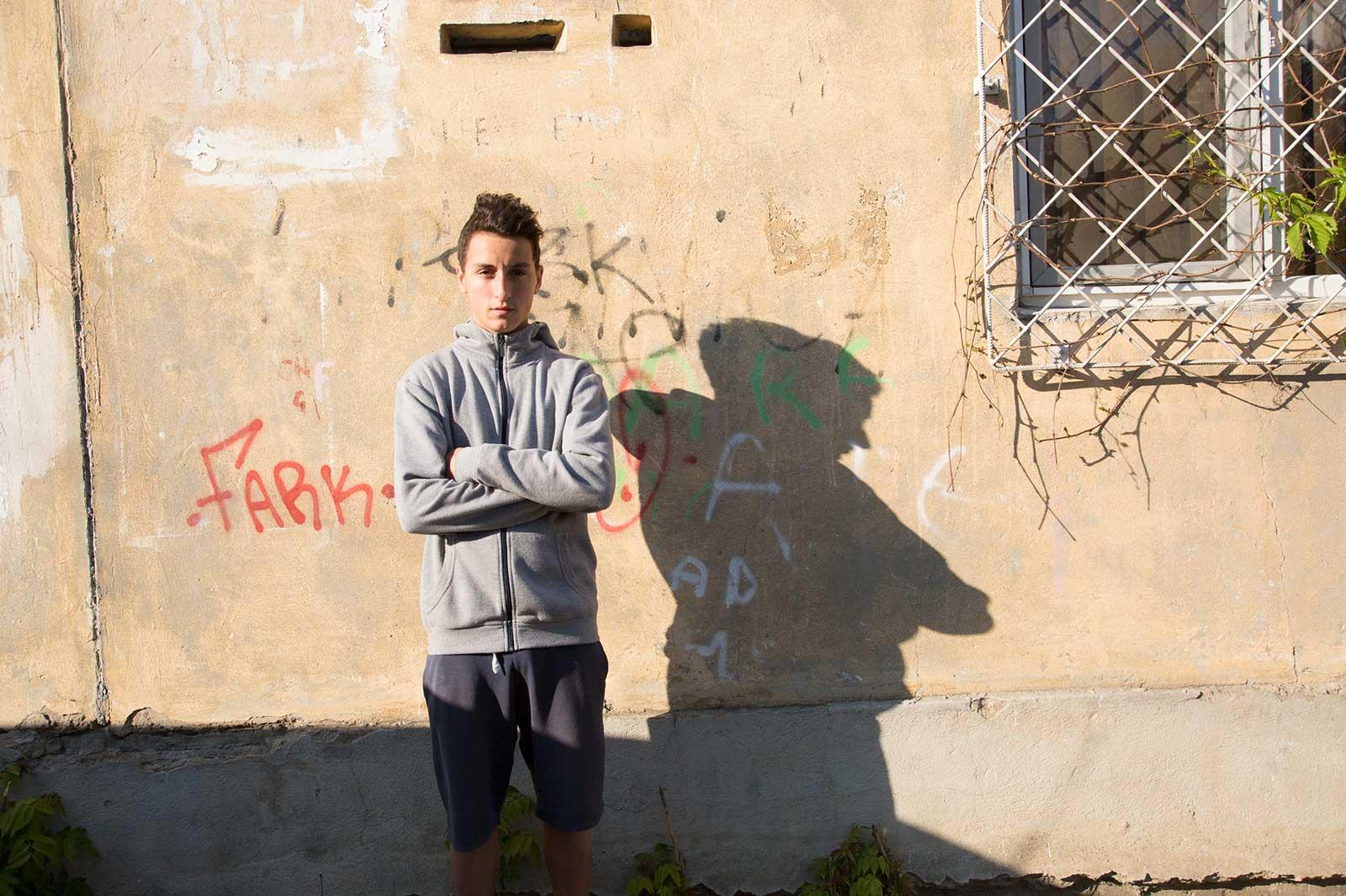 Iounut stands in front of building