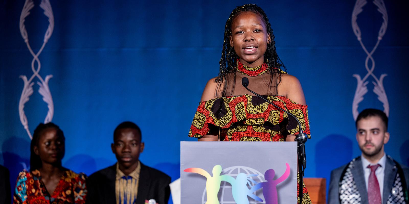 Kim Fusire at the podium. 